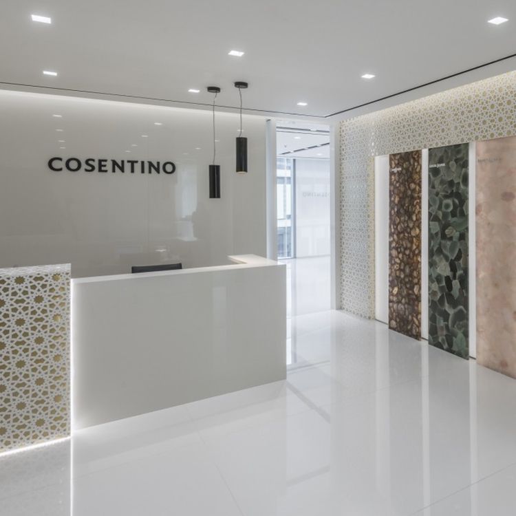 Showroom welcome desk for Cosentino with examples of their offerings featured on walls.