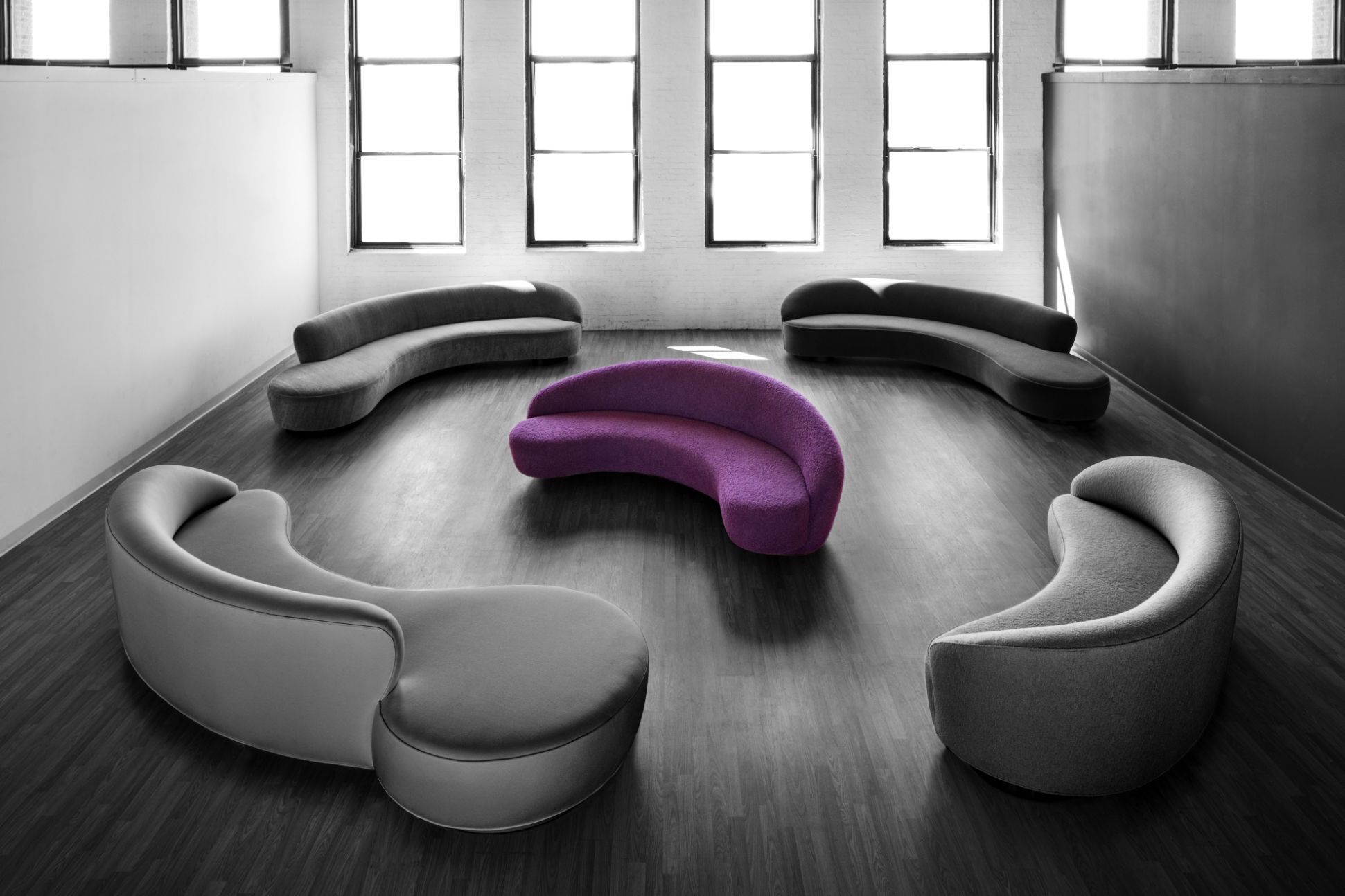 Group of curved couches.